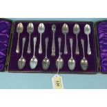 A cased set of twelve Walker & Hall silver teaspoons and tongs, hallmarked Sheffield 1902,