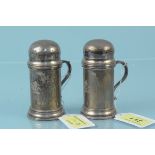 A pair of Britannia silver novelty cruets in the form of dredgers, hallmarked 1903,