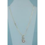 A 9ct gold swirl form pendant set with rose quartz on 9ct gold chain,