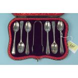 A cased set of six silver teaspoons and tongs, all with engraved initial, hallmarked London 1902,