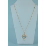 A 15ct gold Art Nouveau turquoise and seed pearl set pendant on a modern 9ct gold necklace,