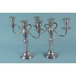 A pair of silver plated twin arm candelabra