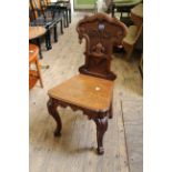 A mid 19th Century carved oak hall chair