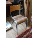 A vintage bent plywood and metal chair