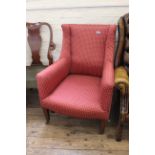 A mid 19th Century mahogany wing upholstered armchair