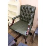 A modern green leather button back office chair