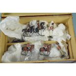 A box containing a collection of vintage lead soldiers including mounted examples