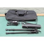 A cased 15-45X sporting scope with an Astral Commando 7-20x30 zoom scope and two bi-pods