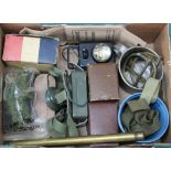 A mixed lot including a sighting scope, helmet light,