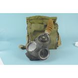 A military issue 1941 dated respirator canvas bag with 1941 dated respirator enclosed