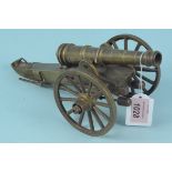 A brass model cannon with a barrel of approx 6"