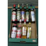 Six various bottles of vermouth plus a bottle of ouzo,