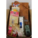 A vintage Sindy doll with accessories including a travel case, boxed hair dryer,