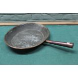 A large 19th Century oval copper frying pan with tubular copper handle,