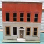 A large vintage dolls house of wood construction