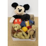 A Mickey Mouse toy plus a bean filled bear by 'Buddy Bear',