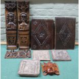 A selection of antique carved wooden panels to include a small pair of cherubs 27cm across,