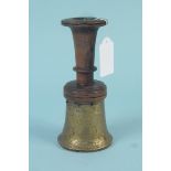 An unusual brass and wooden goblet/candlestick,