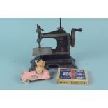 A vintage childs metal sewing machine,