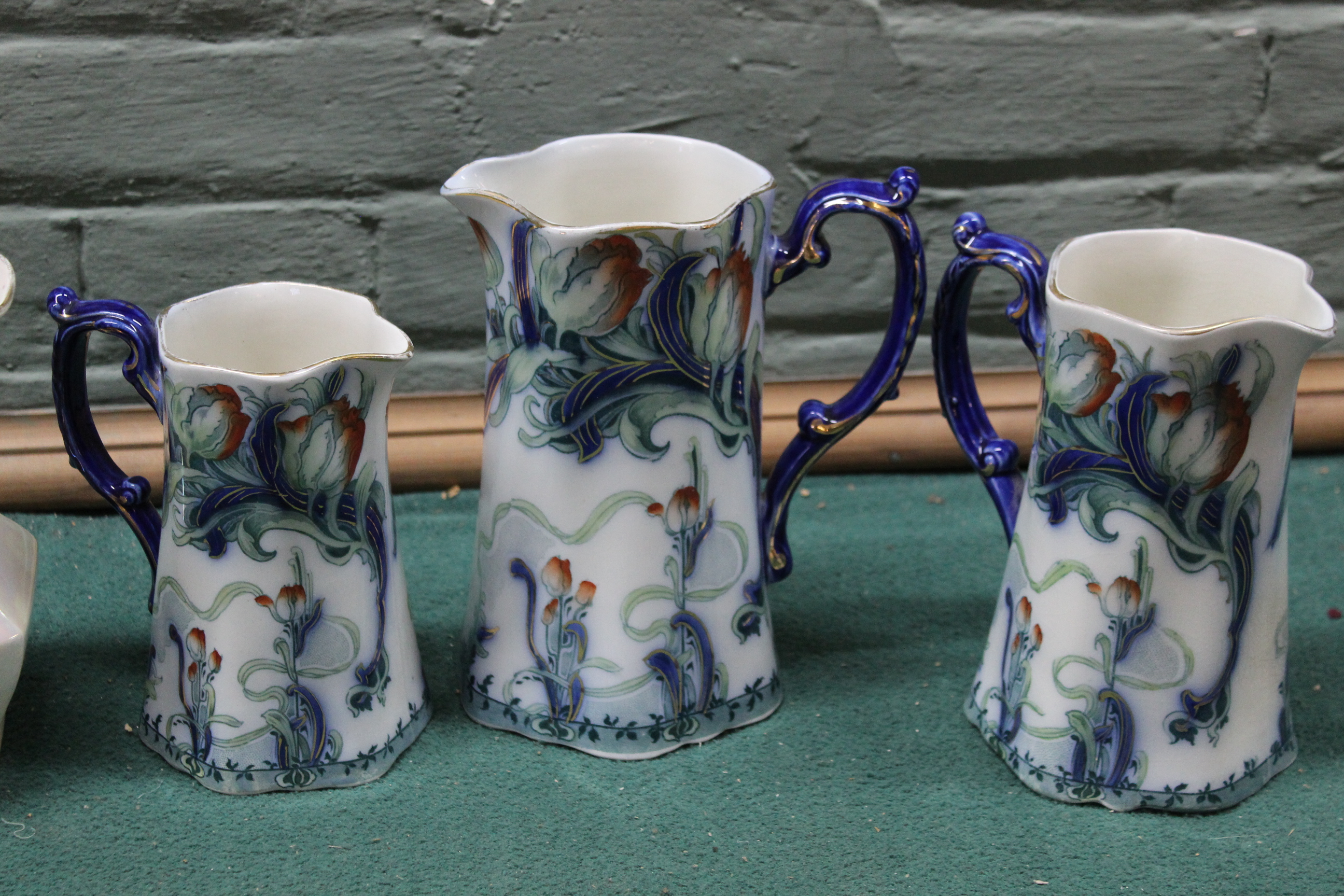 A graduating set of three 'Staffordshire' Art Nouveau jugs plus a pair of Maling ware Ringtons Ltd - Image 2 of 3