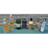 Seven bottles of various maker gins including two Gordons, Tanqueray, Boatyard Double, Bathtub,