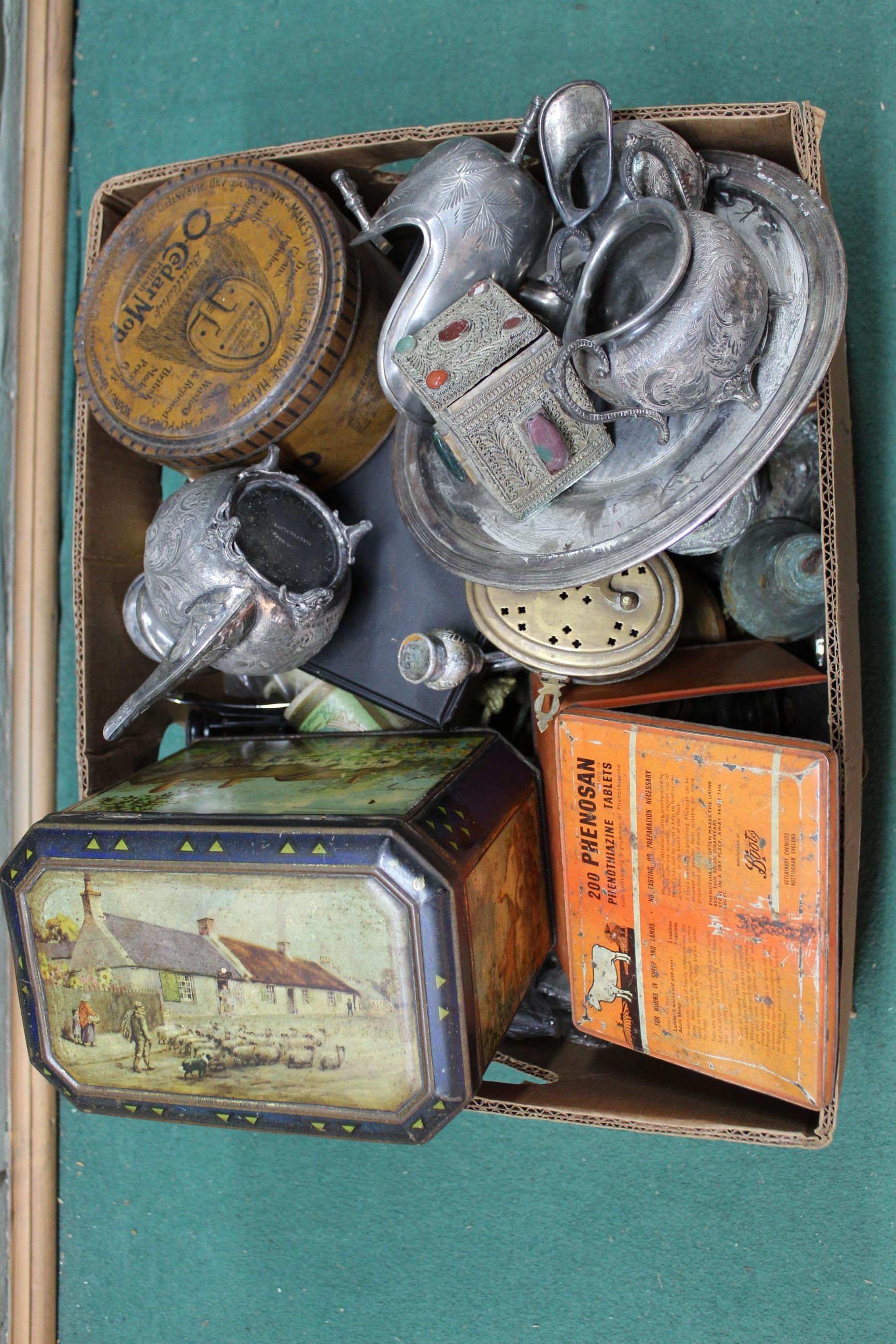 A box of mixed metalwares including a vintage biscuit tin with inner lid