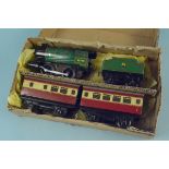A vintage Hornby clockwork train with tender and carriages