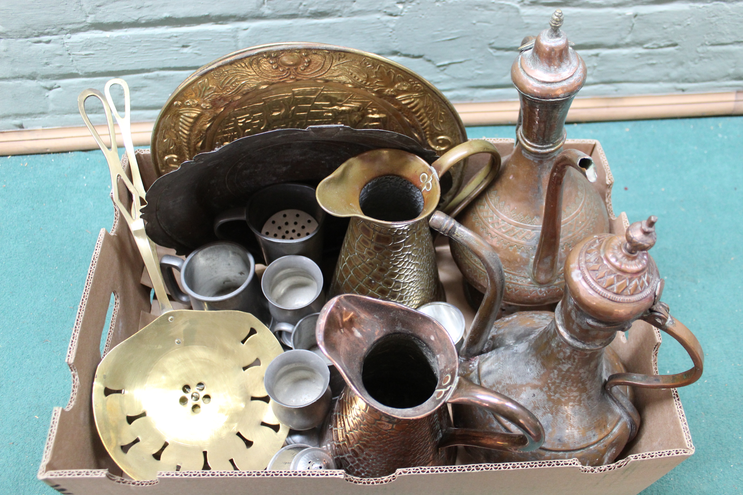 Mixed metalwares including two Persian style copper coffee pots, jugs, plates,