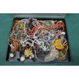 A small tub of costume jewellery,