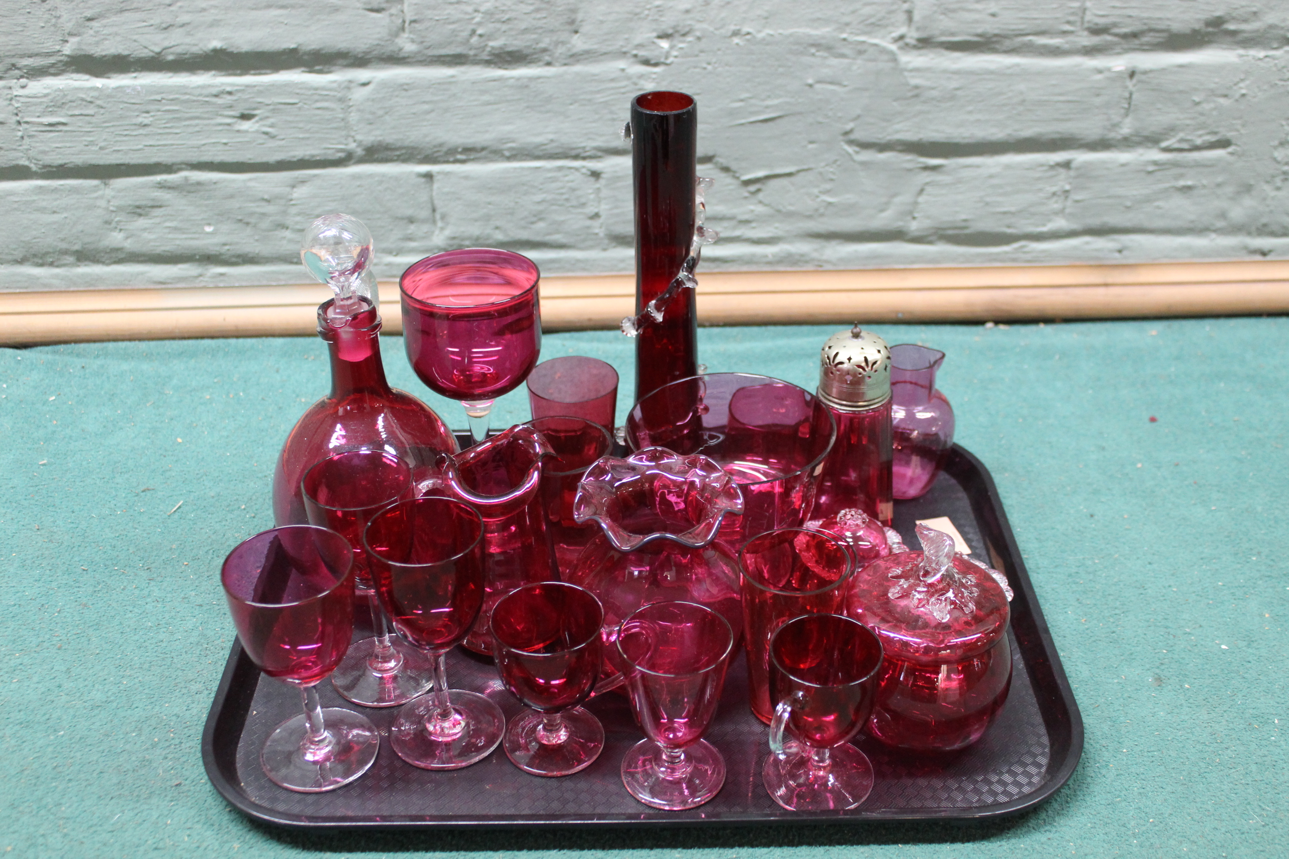 A selection of vintage cranberry glass including claret jug,