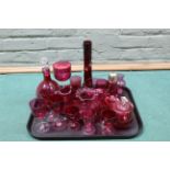 A selection of vintage cranberry glass including claret jug,
