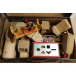 A vintage suitcase full of wooden childrens toys