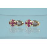 A pair of 9ct gold ruby and diamond set earrings