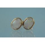 A pair of 9ct gold opal set earrings