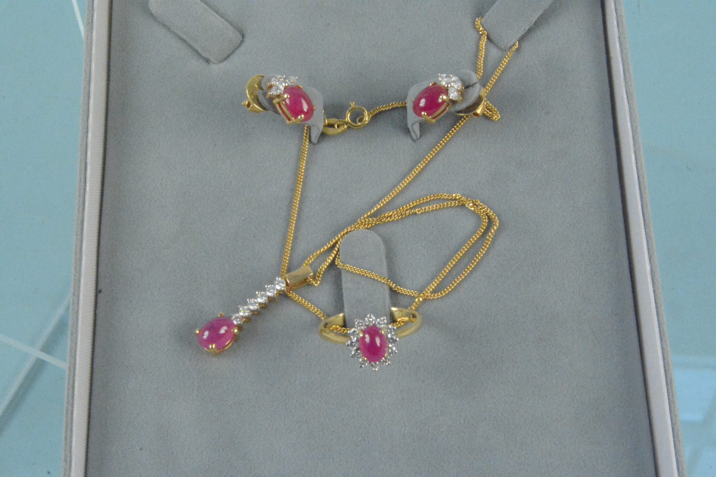 An impressive suite of 18ct gold ruby and diamond jewellery,