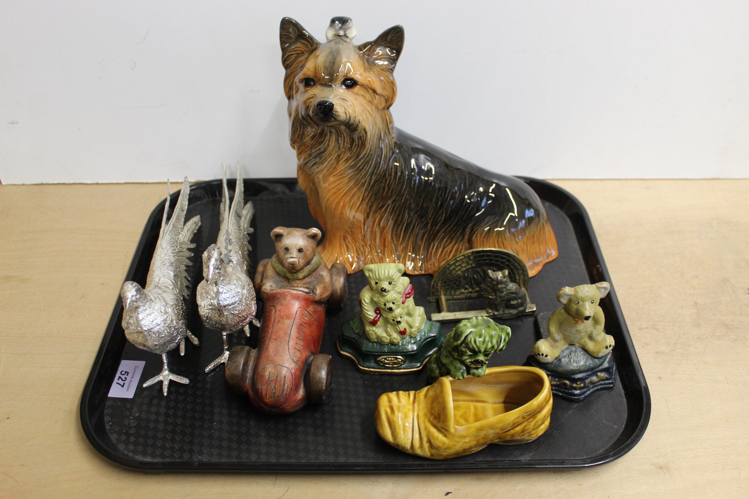 A Kingston pottery Yorkshire terrier, white metal pheasants, Sylvac puppy in a slipper,