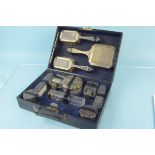A good quality silver mounted glass vanity set with original leather fitted case,