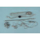 A quantity of silver jewellery including a locket,