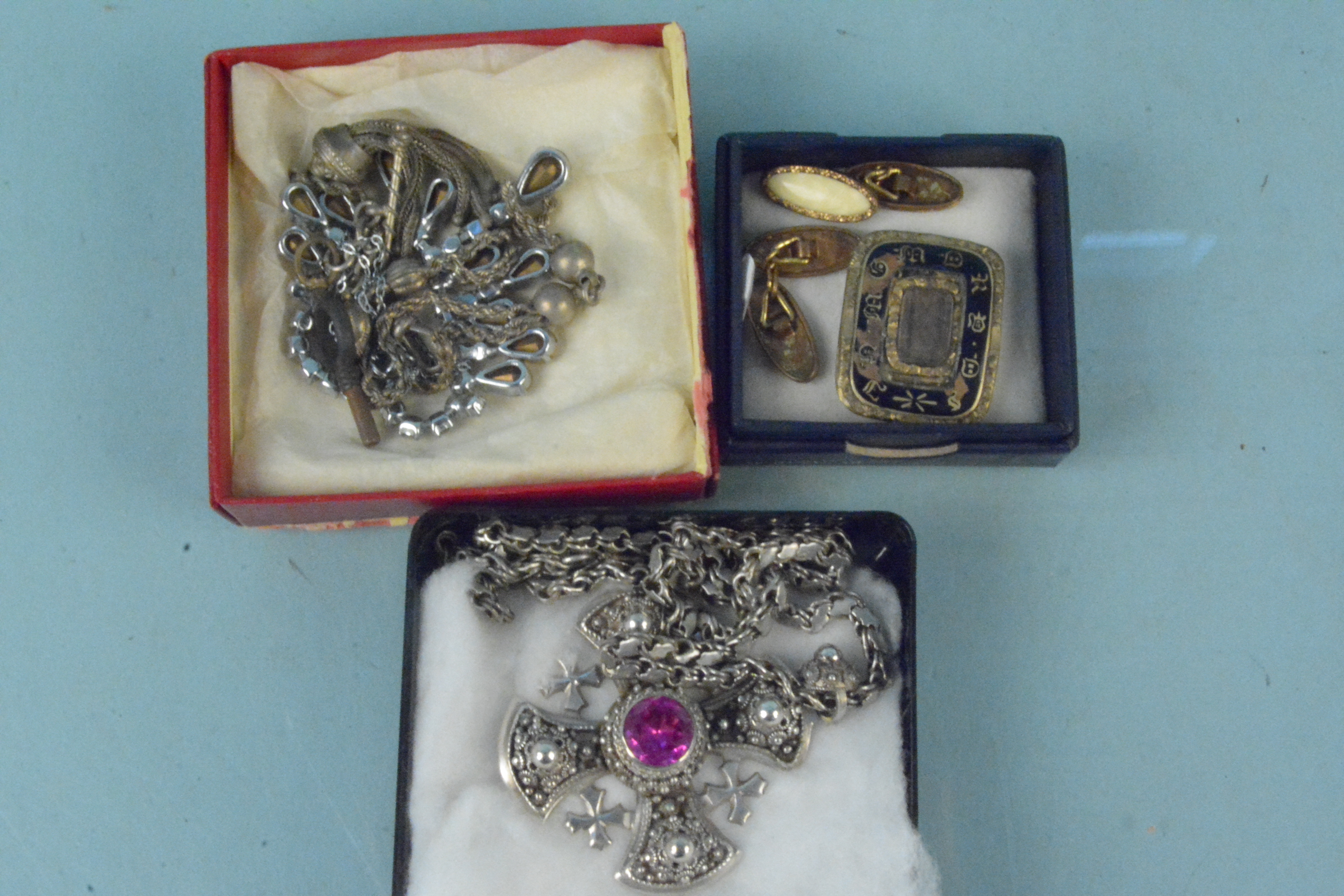A mourning brooch (as found), white metal cross pendant on chain,