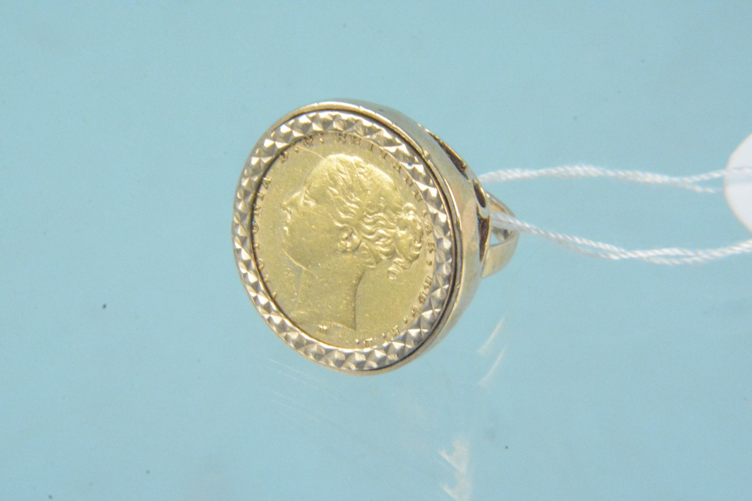 An 1878 sovereign in 9ct gold ring mount, size K 1/2, weight approx 13.