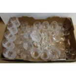 A large box of mixed drinking glasses including lead crystal and a Lalique Paris flower