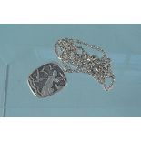 An imposing 875 grade silver pendant with an image of woman figurehead on a ship, birds and clouds,