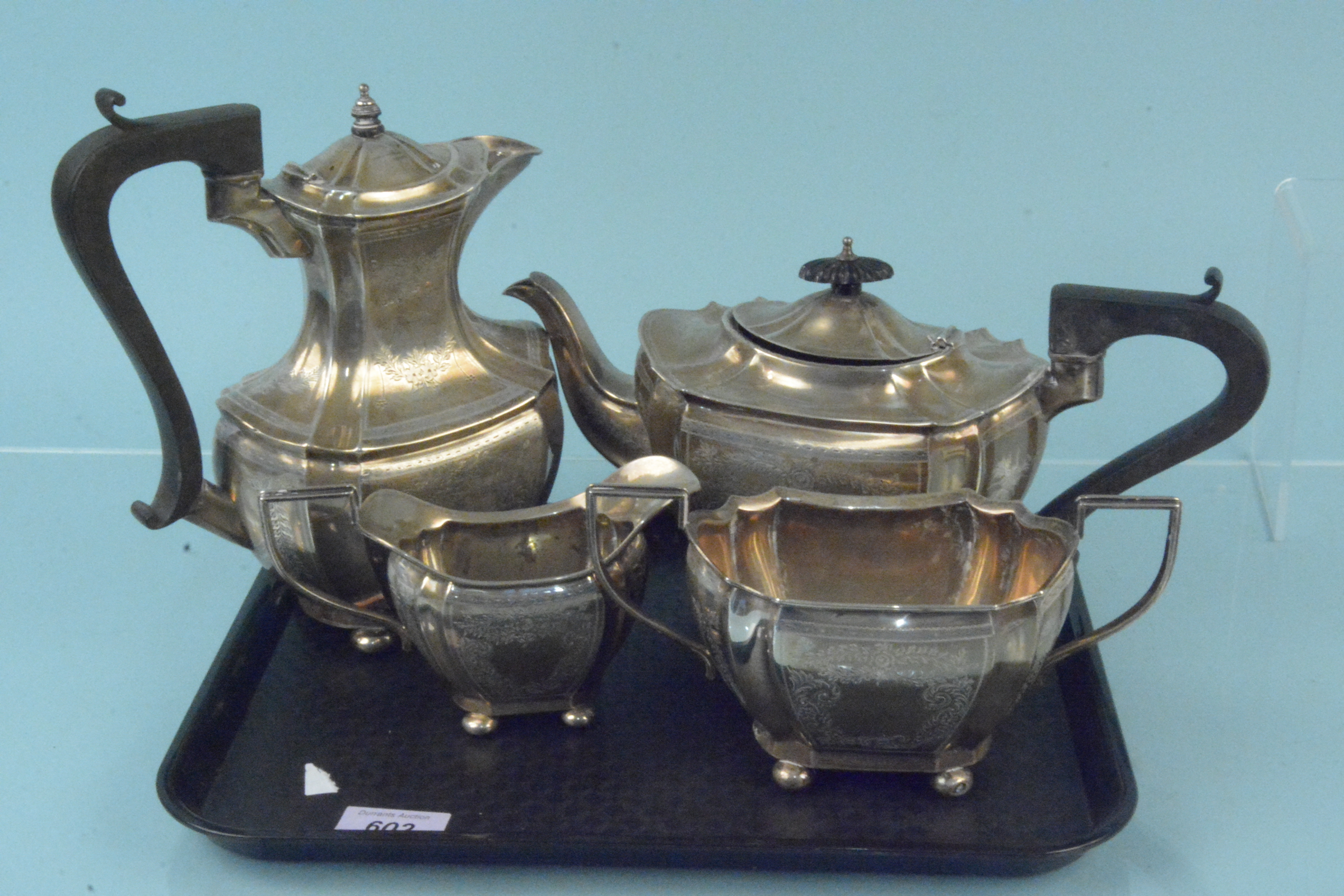 A four piece silver tea set with ornate engraved floral decoration, hallmarked Birmingham 1911,