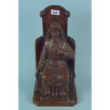 A carved oak figure of a seated Apostle,