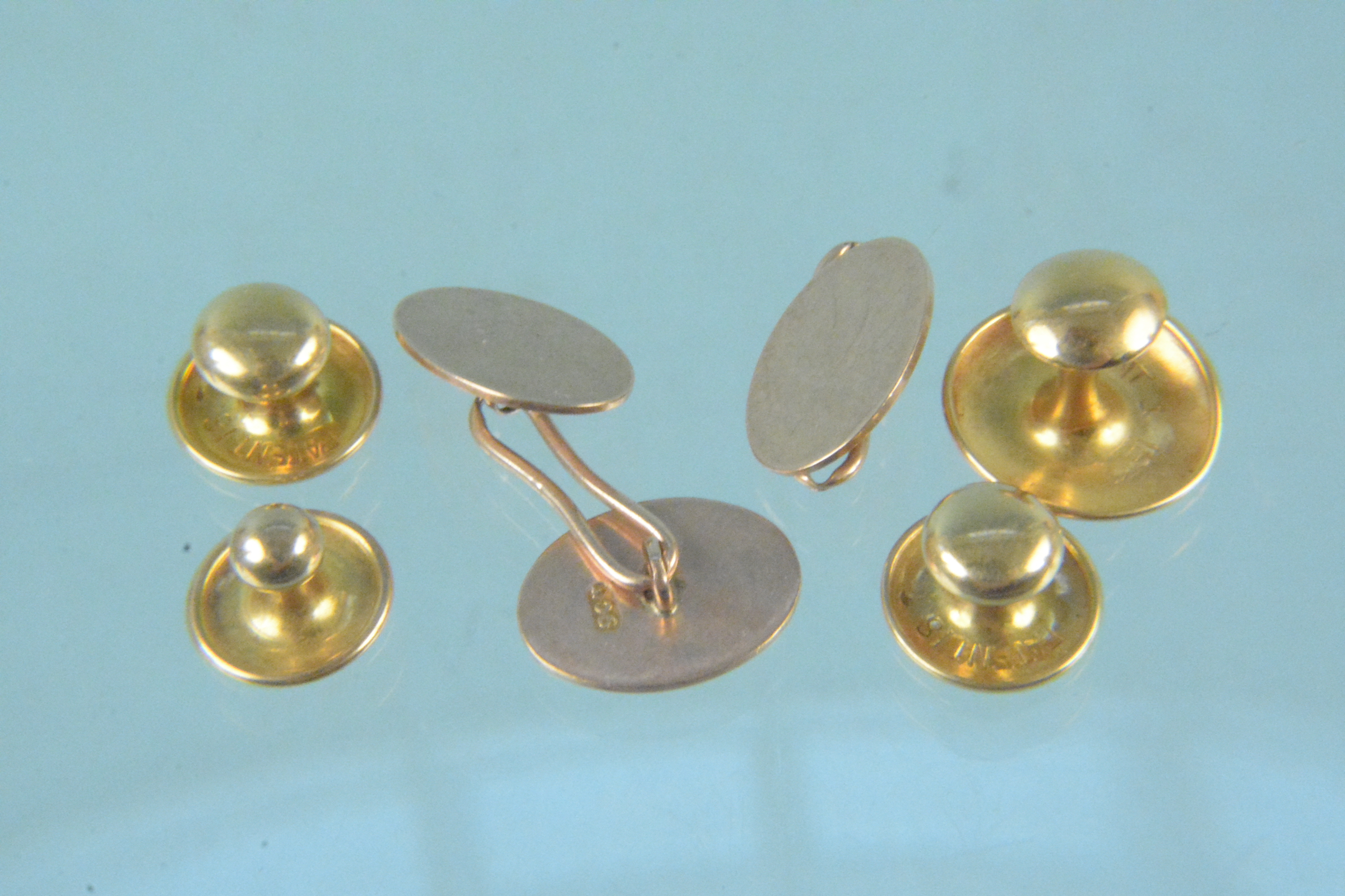 9ct gold cufflinks (one as found), a 9ct gold stud and three 18ct gold studs,