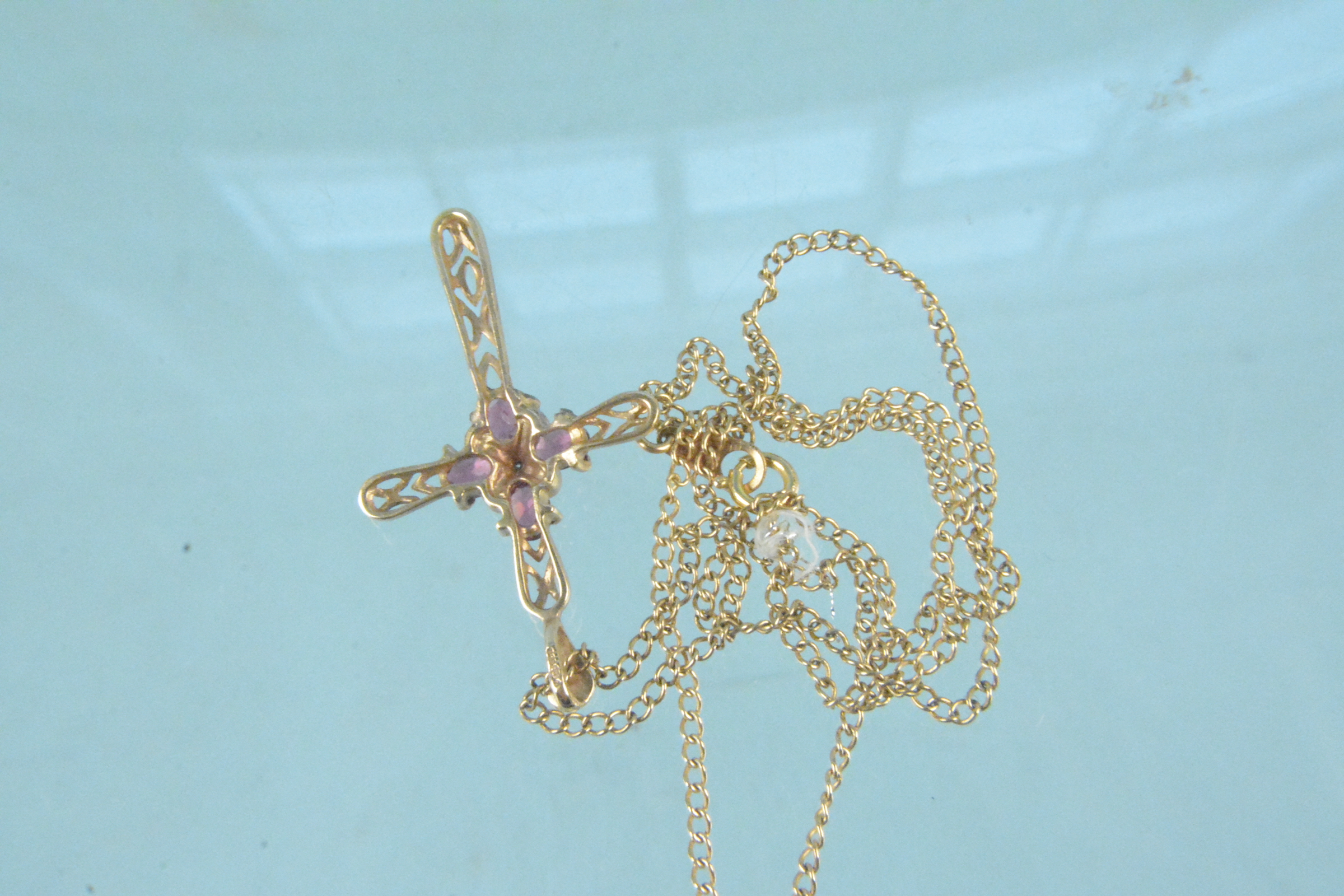 A 9ct gold necklace with pierced pink stone and diamond set cross pendant - Image 3 of 3