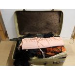 A suitcase containing ladies Victorian mourning dresses, crochet work,