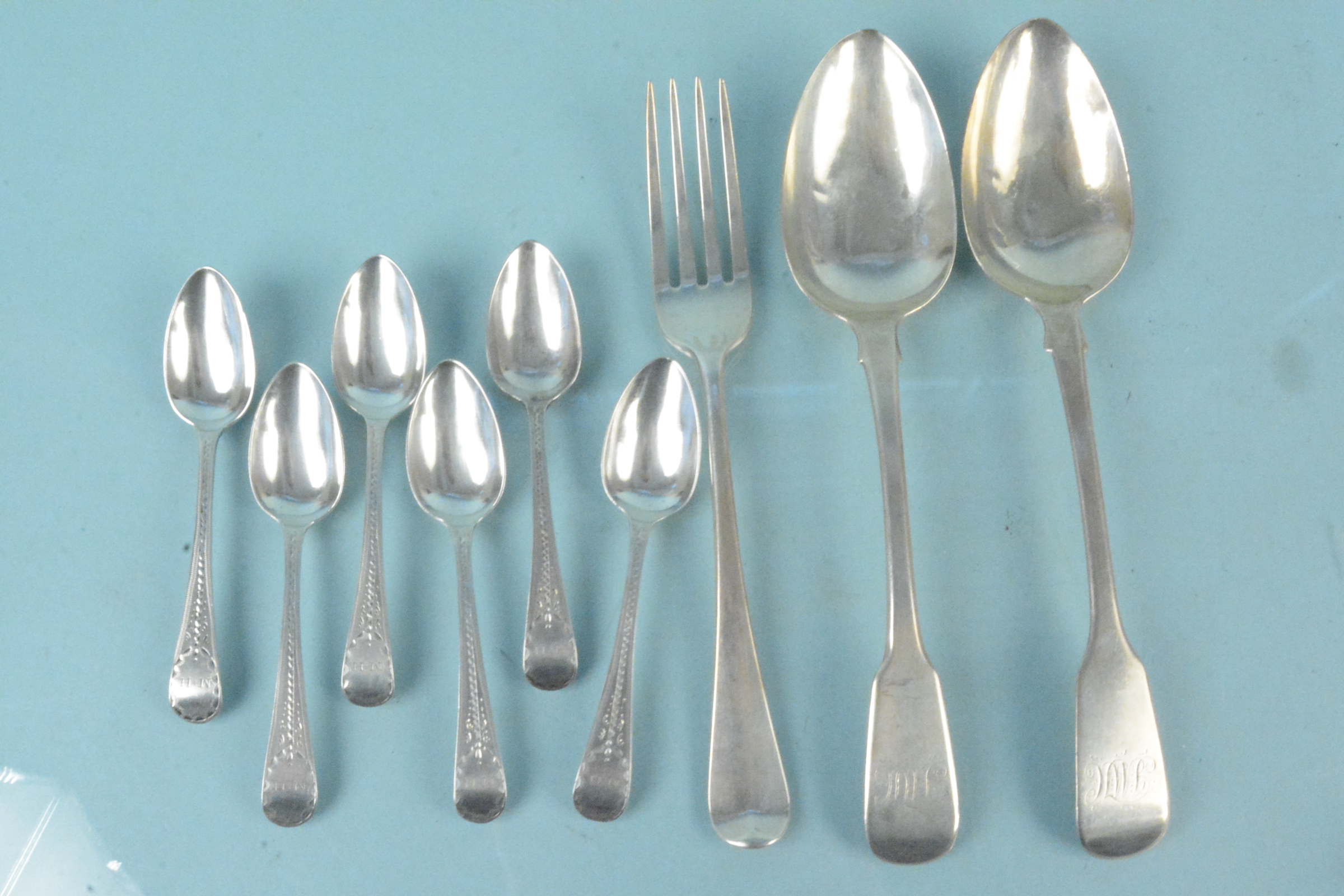 A collection of Georgian silver cutlery to include a set of six teaspoons,