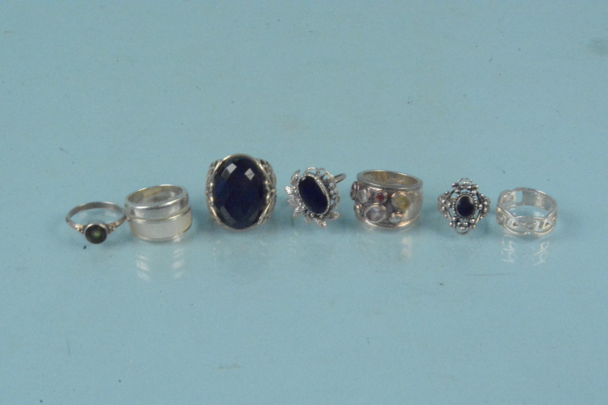 Seven silver stone set rings