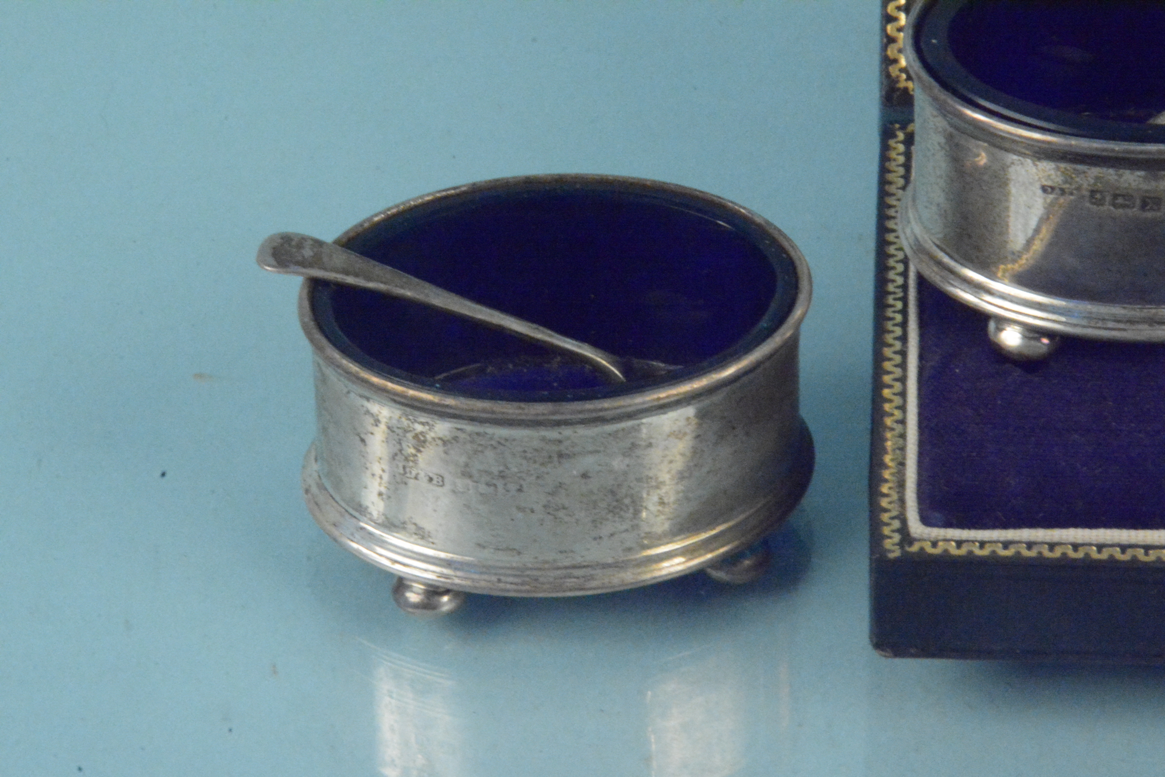 A collection of silver to include two oval salts with blue glass liners, spoons, - Image 2 of 3